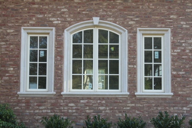 Indiana limestone door and window surround on masonry facade, Tulip Precast