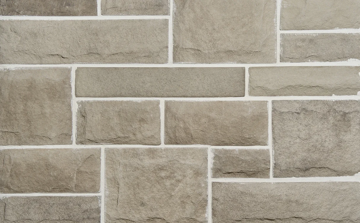 Indiana limestone smooth thin veneer installed on luxury residential exterior, Tulip Precast