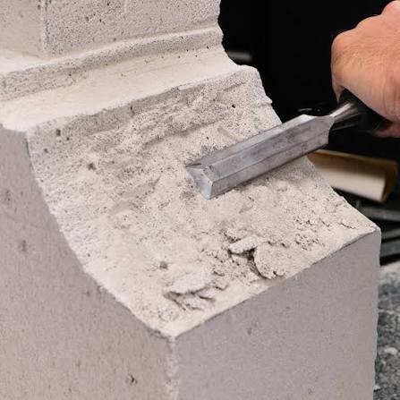 Artisan Indiana Limestone carving — intricate architectural ornament custom fabricated by Tulip Limestone Precast, Brampton Ontario